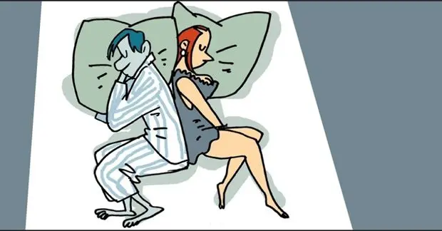 Pareja que duerme de espaldas