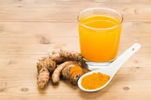 A glass of turmeric tea.