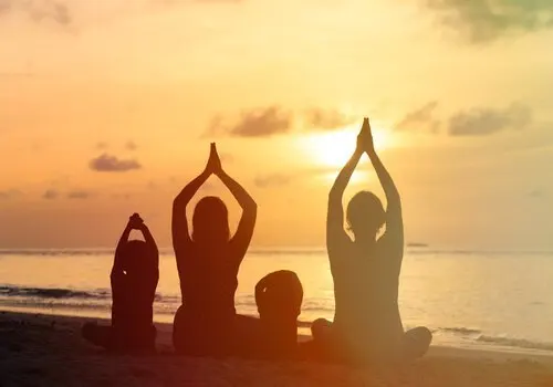 A family meditating together.