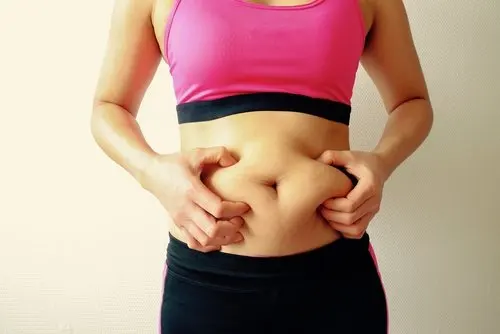 A woman grabbing herself.