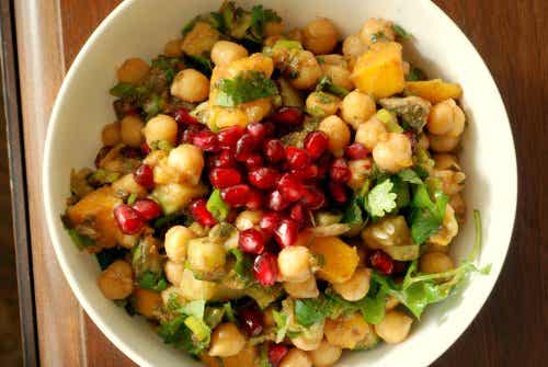 A bowl of chickpea, mango and pomegranate salad