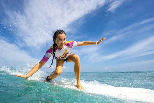 A woman surfing.