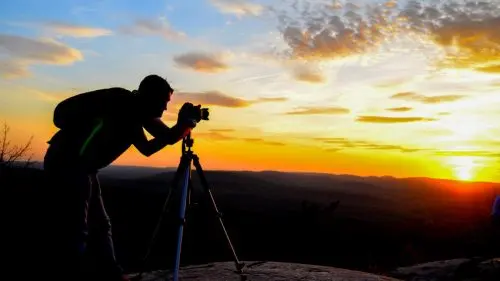 Man taking pictures of the sunset