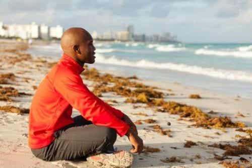Man meditating in the beach