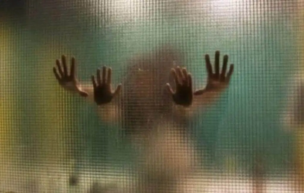 A couple having sex from behind in the bathroom.