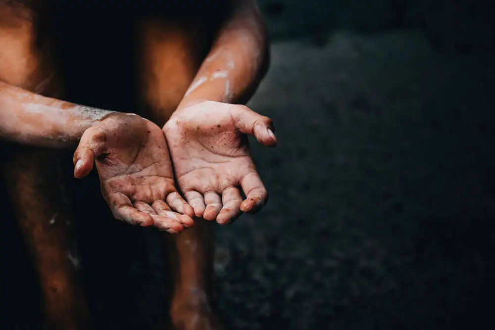 the hands of a poor person