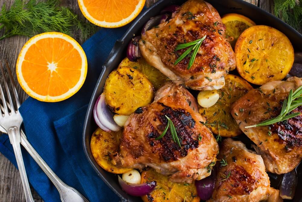 Pollos al horno con naranja y romero