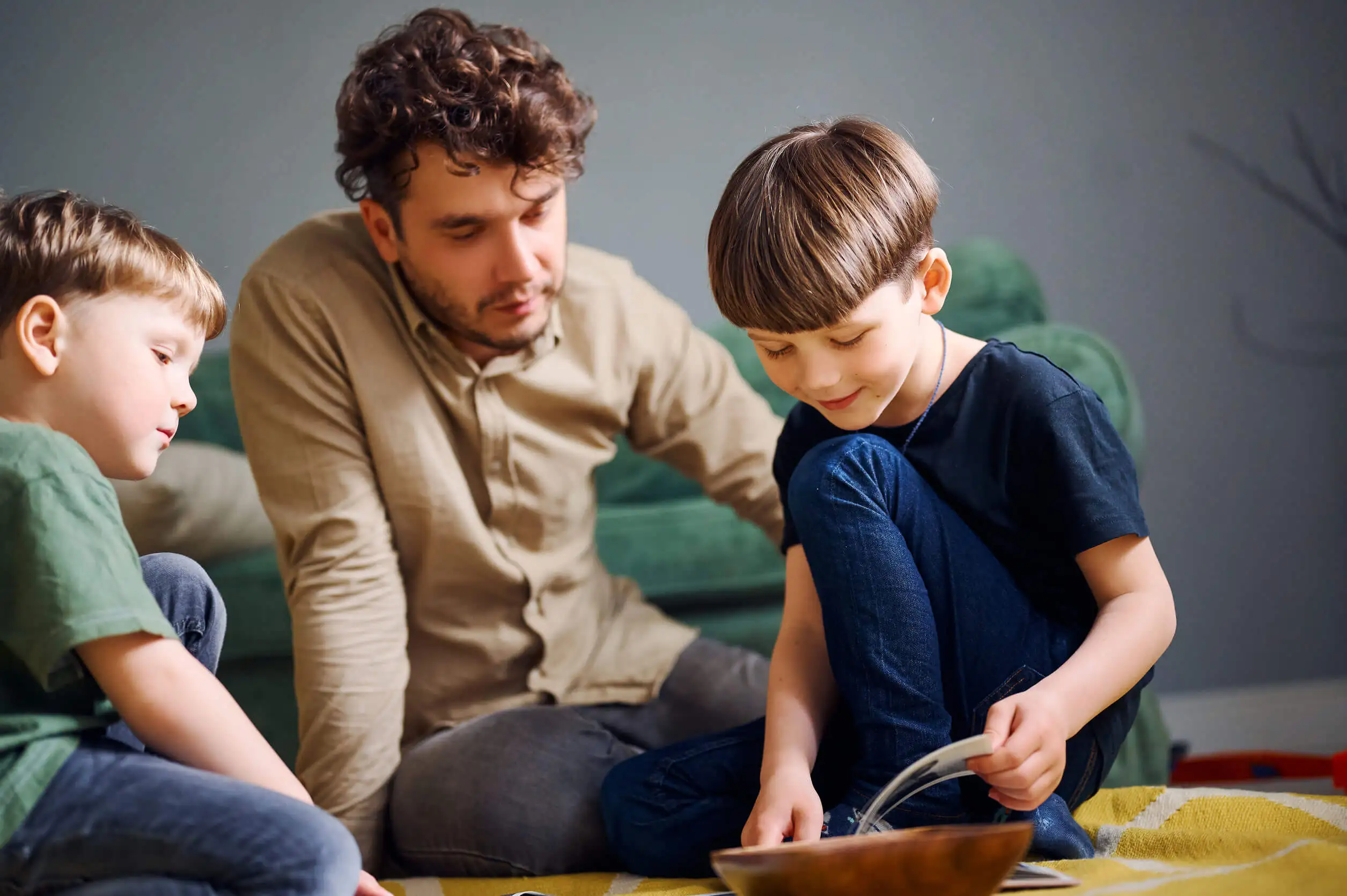 a father playing with his sons