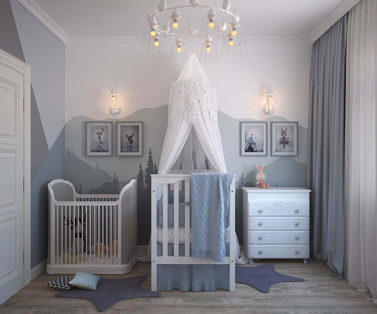 Habitación infantil con cuna y varios muebles y cuadros en tonos grises.
