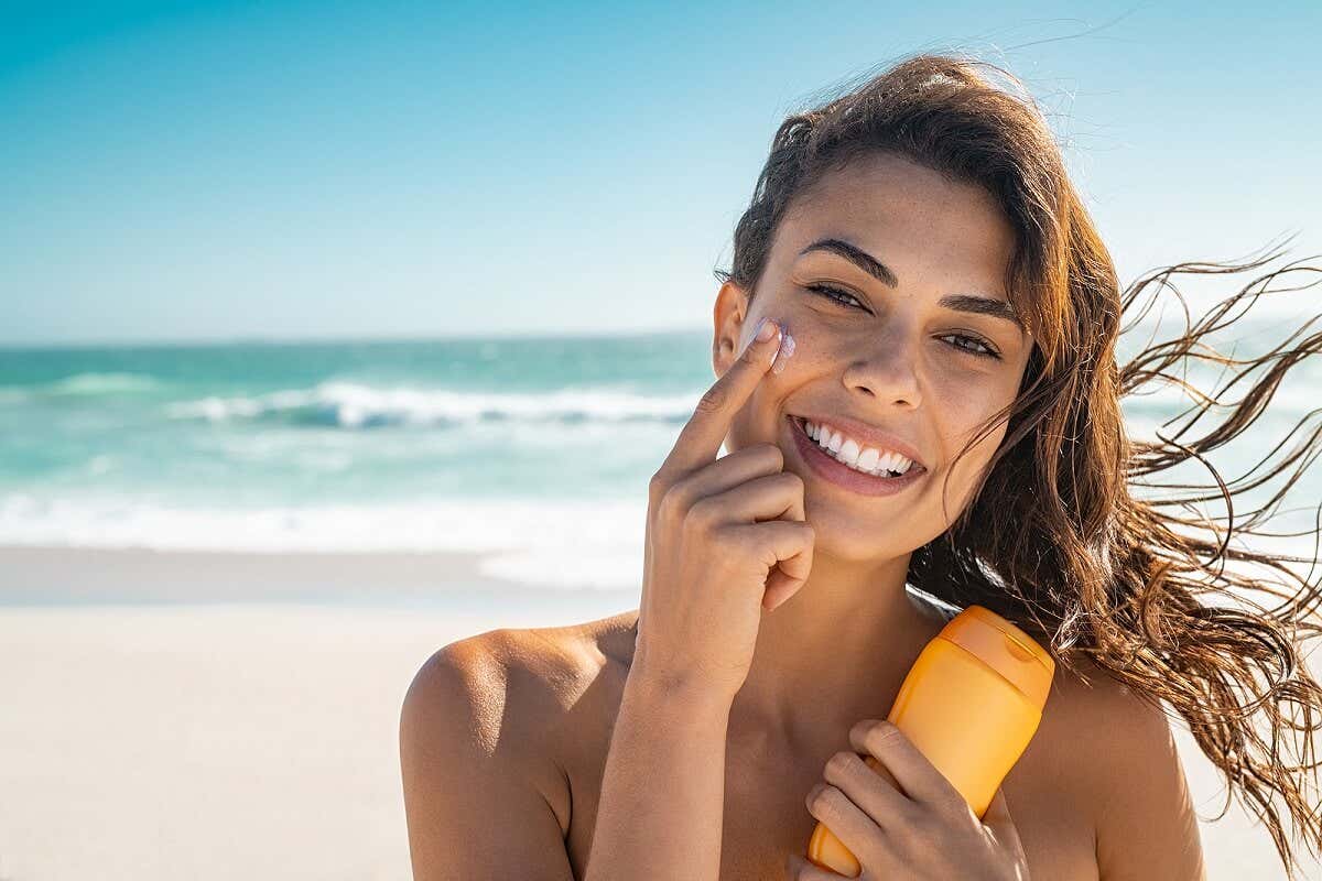 A woman using sun cream.