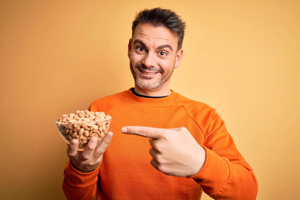 Man with a bowl of peanuts