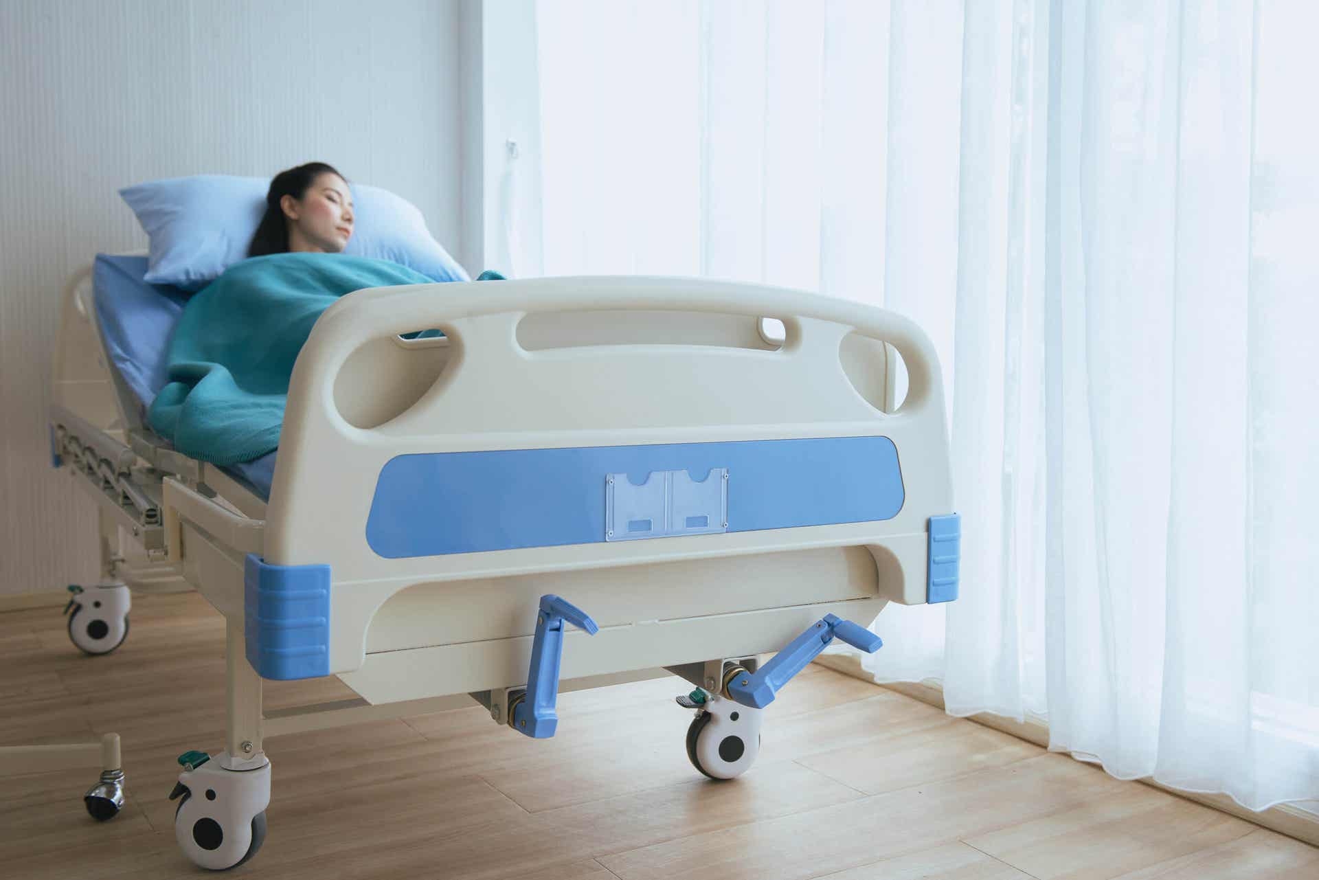 Medizinphilosophie - Frau in einem Krankenhausbett