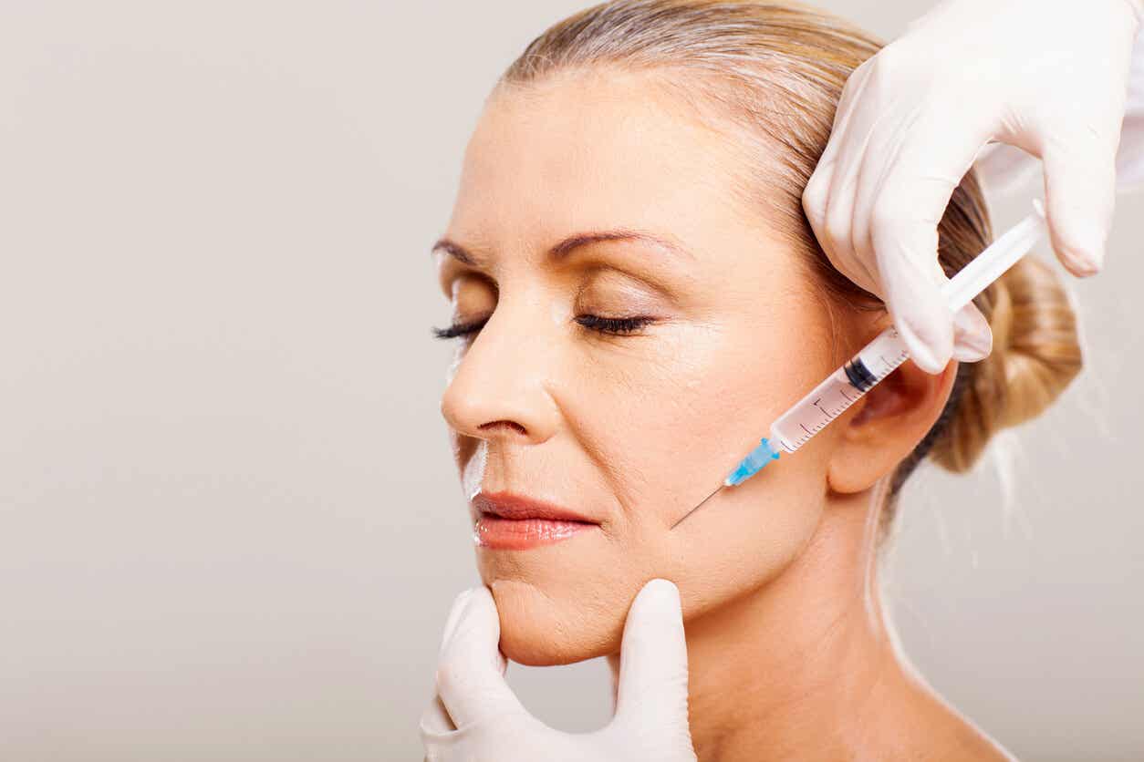 Injection in the face with dermal fillers.