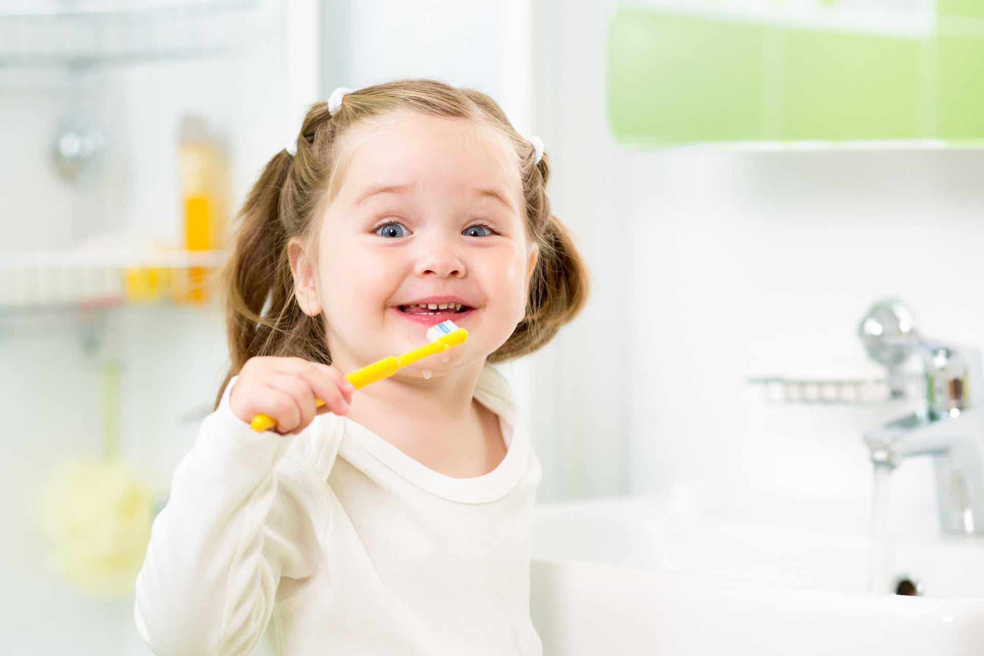 A girl brushing her teeth.