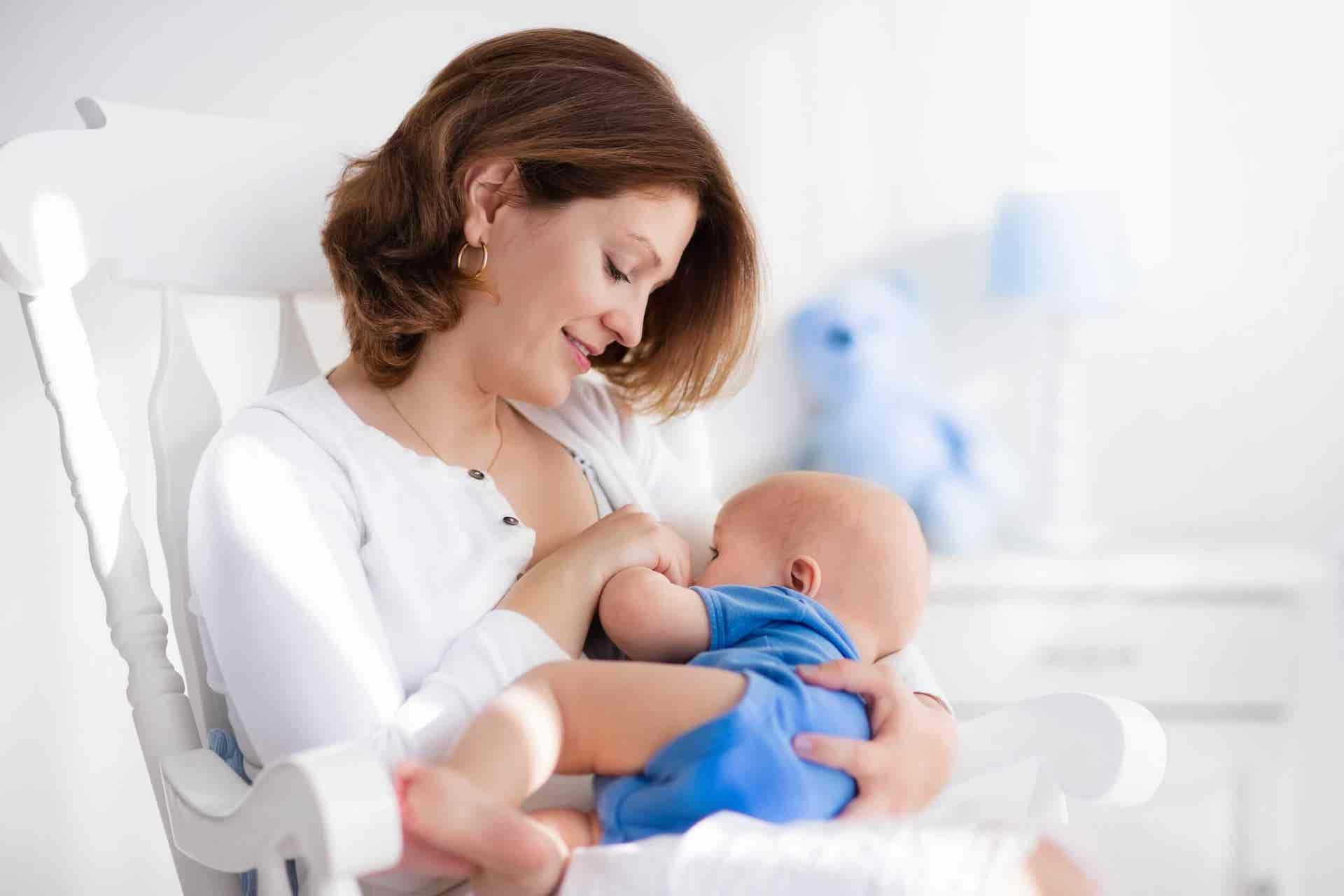 a woman breastfeeding a baby