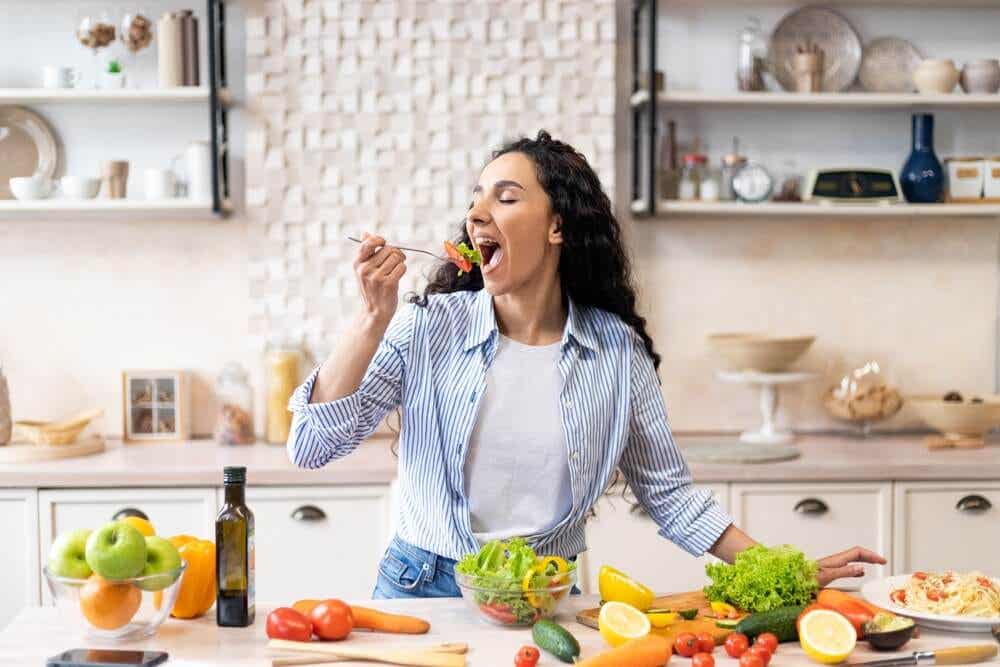 A woman in the kitchen with healthy food