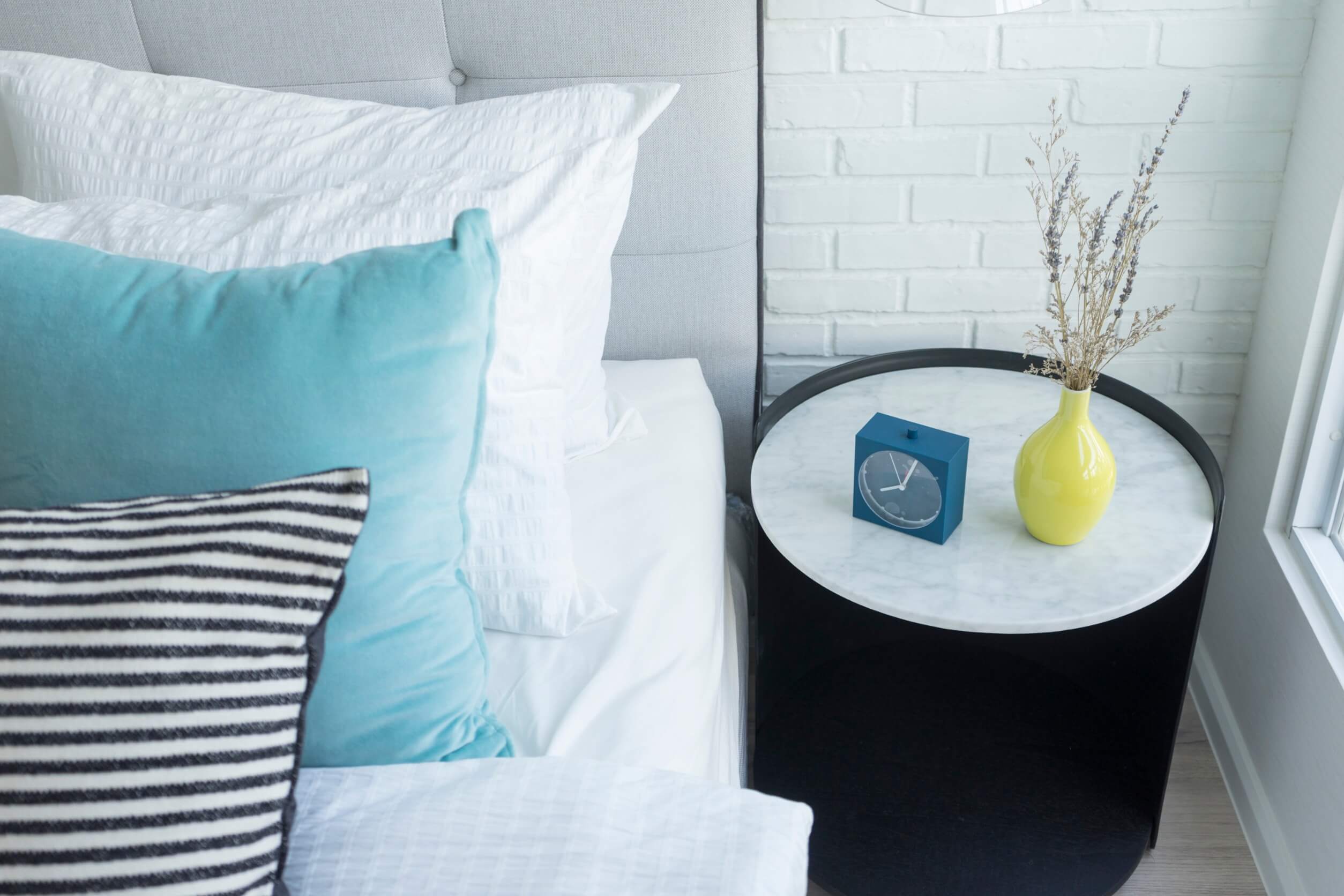 A bed and side table.