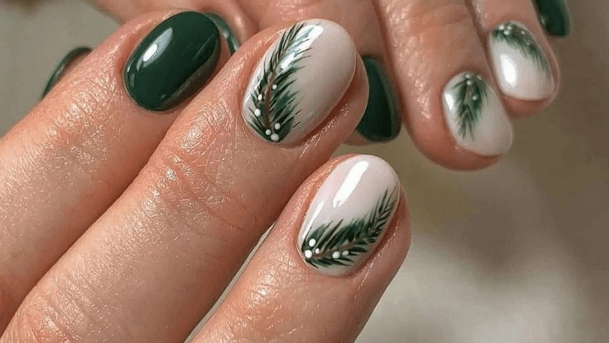 Unhas verdes e claras com folhas.